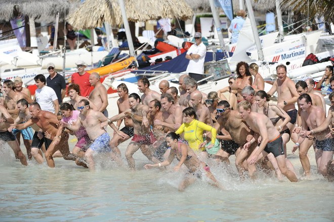 Start of the swimming contest - Dart 18 Worlds and Aruba Heineken Catamaran Regatta © Steve Arkley http://www.sailshots.co.uk